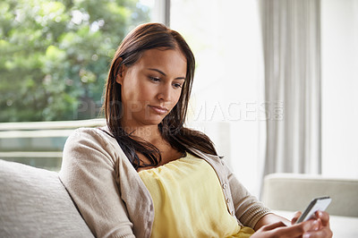 Buy stock photo Woman, reading and relax on couch with phone on holiday or vacation in home streaming an ebook or article. Calm, break and learning about history, information or news from blog on sofa in apartment