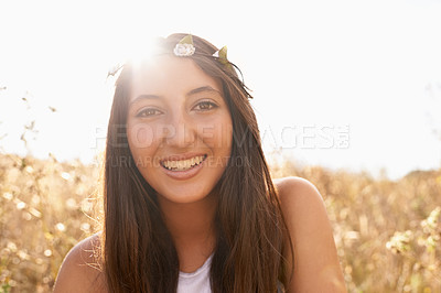 Buy stock photo Woman, portrait and happiness in sunlight for travel, fresh air and summer holiday with lens flare in Amsterdam. Person, face or smile in countryside with confidence, pride or flower crown in nature 