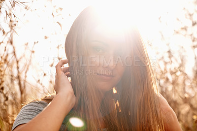 Buy stock photo Portrait, field and woman with smile in sunlight for travel, fresh air and summer holiday with lens flare in morning. Person, face or happy in or meadow countryside with confidence or pride in nature