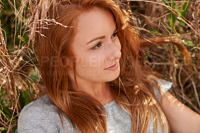 Buy stock photo Woman, ginger and relax with wheat field in nature for summer holiday, weekend or outdoor break. Face of attractive female person or redhead chilling on grass for natural fresh air in the countryside