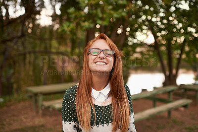 Buy stock photo Teen, girl and smile in outdoor nature, wellness and relax in woods or forest on summer holiday. Happy female person, trees and confidence in park or garden, calm and peace on travel to Amsterdam
