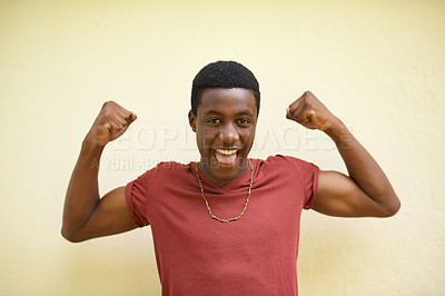 Buy stock photo African, portrait and teenager with smile, flex and happiness for youth and cool. Student, strong and positive with macho, identity and inspirational or motivation on wall background outdoors