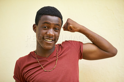 Buy stock photo African, portrait and teenager with proud, flex and happiness for youth and cool. Student, strong and positive with macho, identity and inspirational or motivation on wall background outdoors