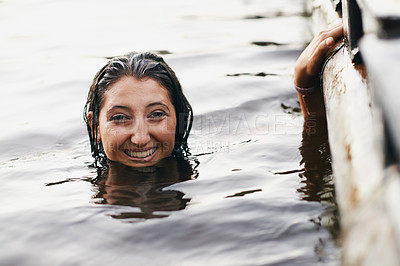 Buy stock photo Portrait, swimming and girl with water, vacation or sunshine with weekend break or fresh air. Person, outdoor or relax with wellness or holiday with smile or wet with nature or lake with getaway trip