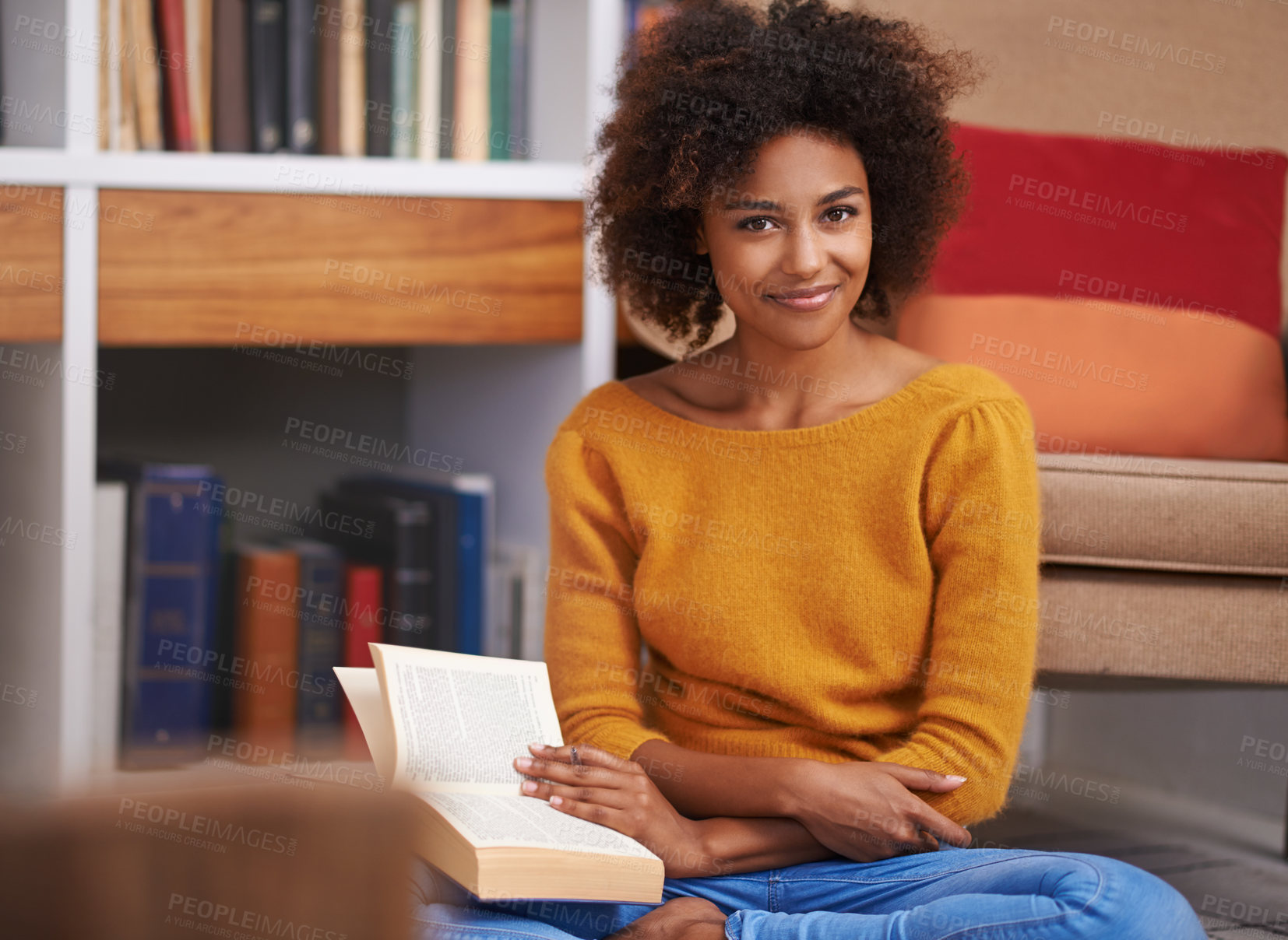 Buy stock photo Portrait of an attractive young woman reading a book