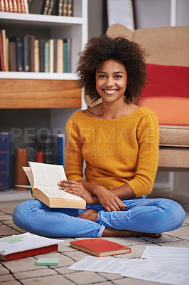 Buy stock photo Portrait, smile and African woman in library, floor and books for education. Textbooks, paper and study material for happy female student with natural afro hair, learning and notes for knowledge