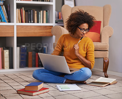 Buy stock photo Laptop, books and African woman in library, floor and study for education. Thinking, learning and eyewear for female student with natural afro hair, assignment or technology for knowledge and reading