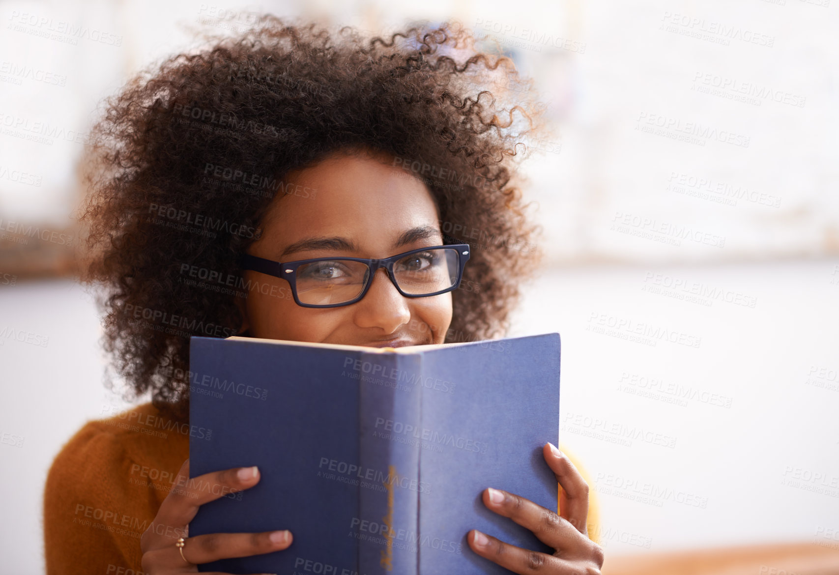 Buy stock photo Portrait, black woman and reading book in living room to relax for literature, leisure and hobby in home. Happy, education and face of female student for learning, knowledge and information 