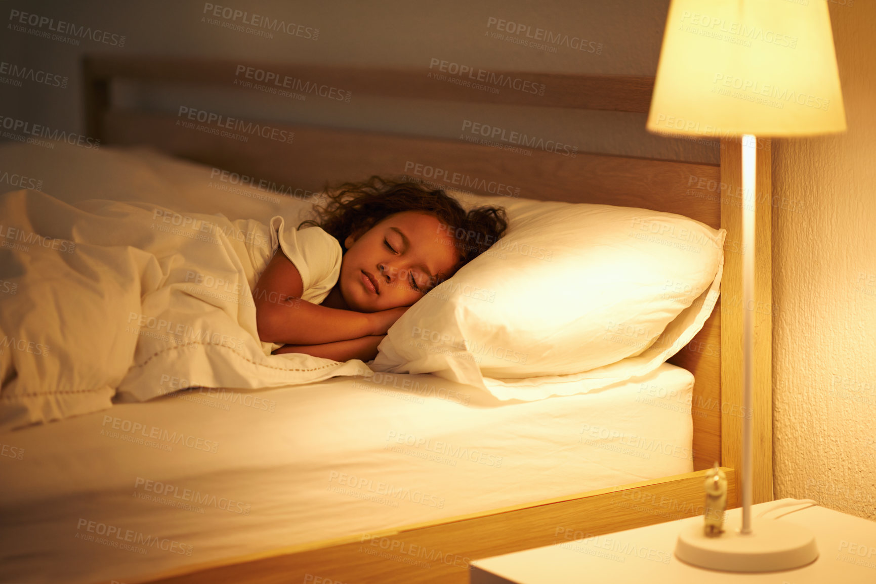 Buy stock photo Girl, sleeping and peace in bed at night, comfortable and tired or dream on pillow in home. Female person, child and resting in bedroom or lying to relax, exhausted and fatigue or peace and calm
