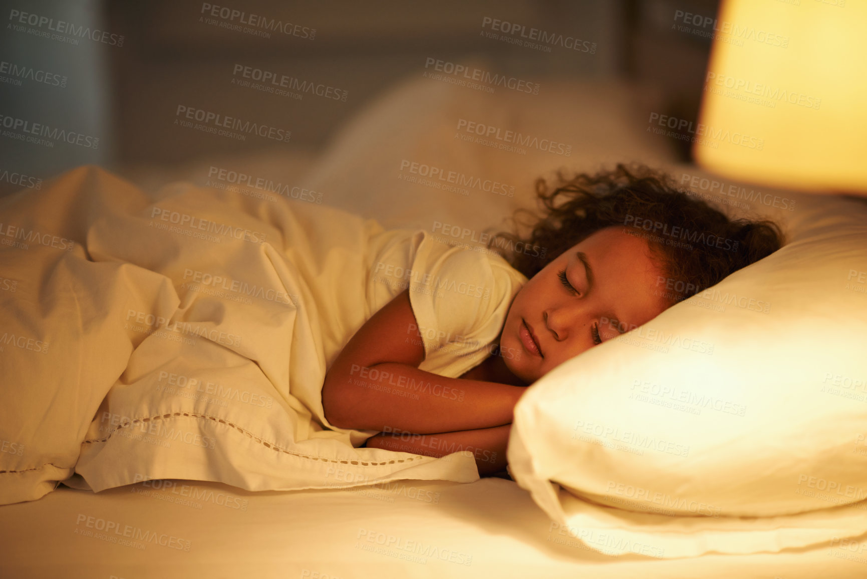 Buy stock photo A cute little girl fast asleep in a double bed