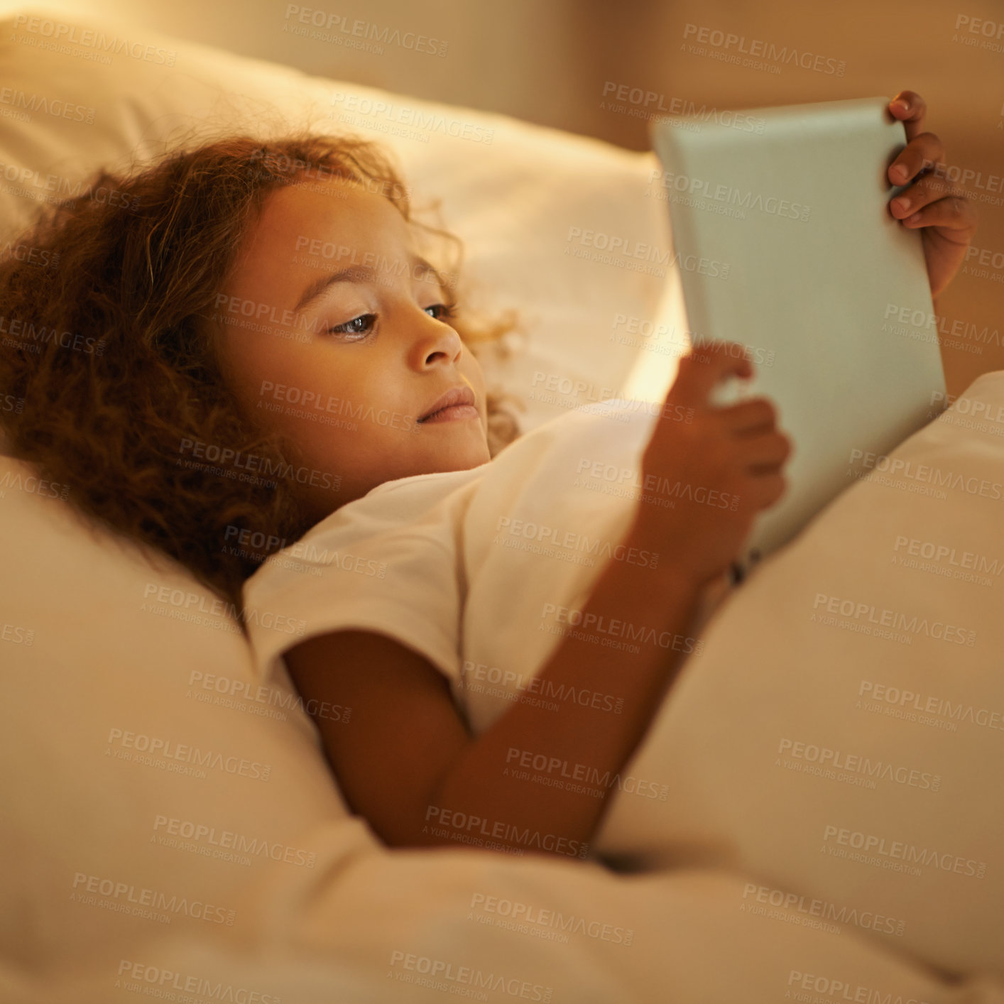 Buy stock photo Bedtime, child and tablet in bed at night, comfortable and online for games or play in home. Female person, girl and rest in bedroom or closeup to relax, website and internet or app for entertainment