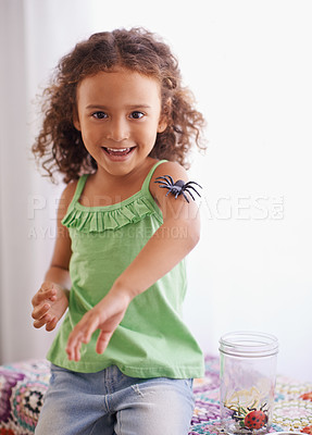 Buy stock photo Portrait, child and toys in room for development, curiosity and growth with insect jar. Happiness, animal and face of young girl playing in kindergarten for learning, discovery or education.