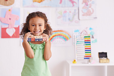 Buy stock photo Shot of a cute little girl playing with alphabet blocks