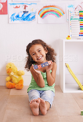 Buy stock photo Girl, portrait and learning alphabet with blocks in home, child development and growth with letters. Female person, kid and abc on floor for language, bedroom and creative game for education with toy