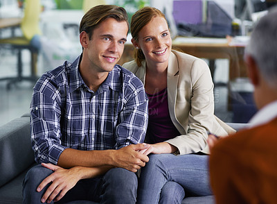 Buy stock photo Marriage, therapy and couple happy with counselling in communication with partner, together and couch. Consulting, man and woman holding hands, conversation and psychologist in office for advice