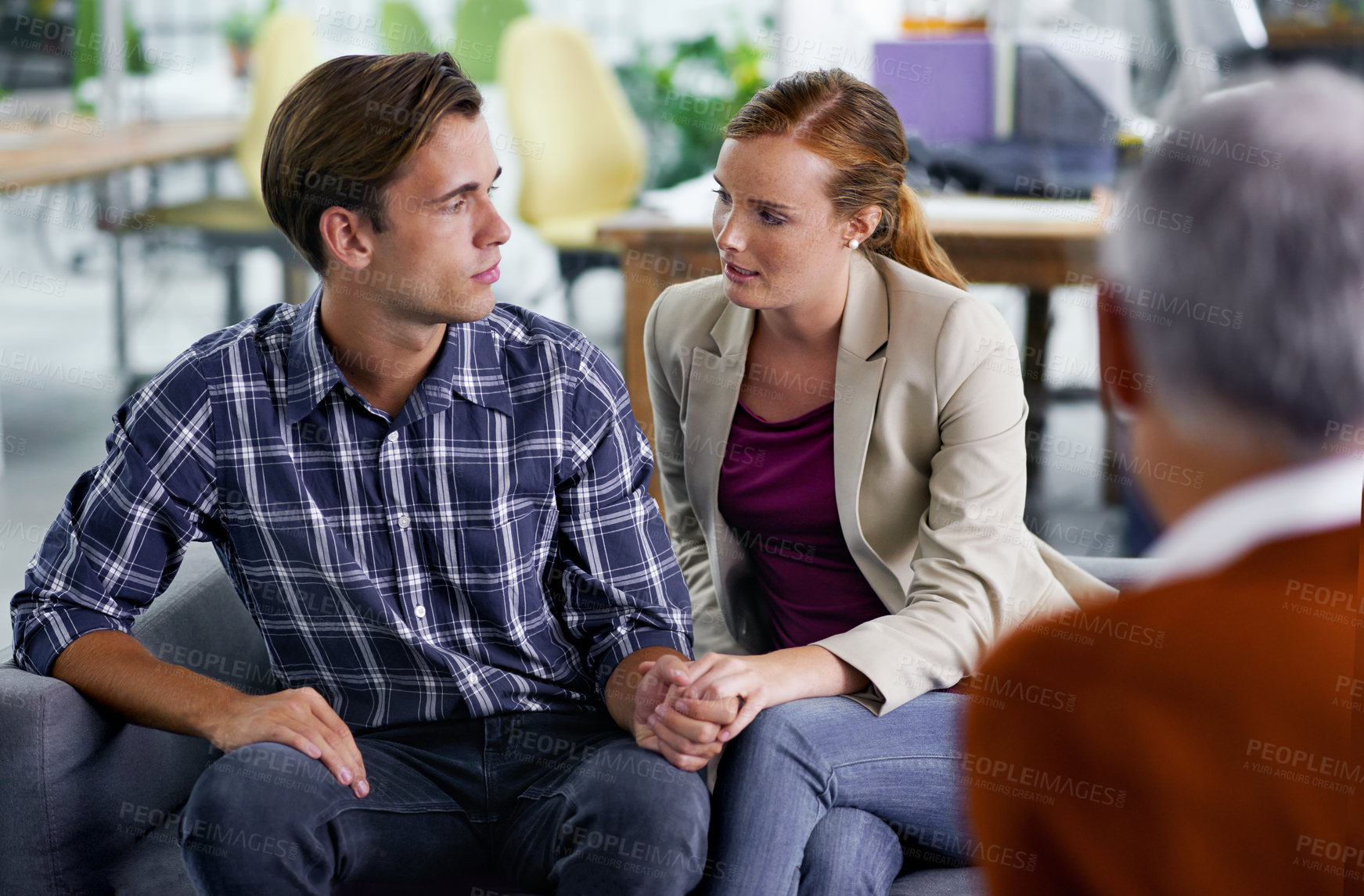 Buy stock photo Marriage, therapy and couple in meeting for advice in communication with partner, together and couch. Consulting, man and woman holding hands, conversation and psychologist in office for counselling