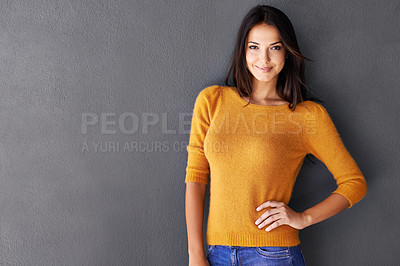 Buy stock photo Mockup space, fashion and woman in studio, portrait and cool or trendy style in gray background. Female model, smile and confidence or proud, standing and stylish or edgy in casual outfit or clothes
