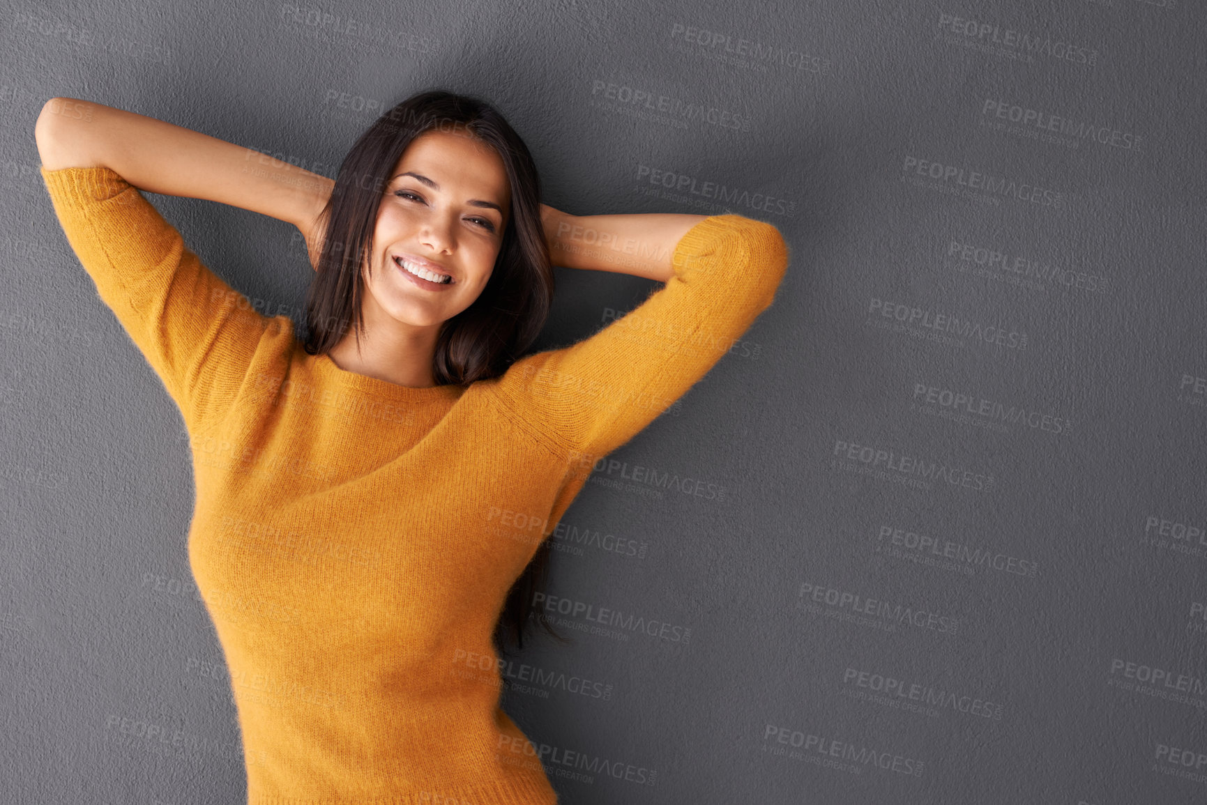 Buy stock photo Fashion, female model and relax in portrait or studio, trendy style or cool in gray background. Woman, smile and happy with confidence in mockup space, stylish and pullover for casual outfit