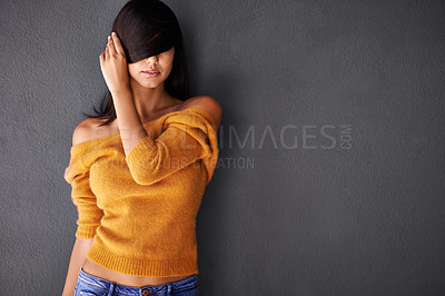 Buy stock photo Woman, hand and hair in studio cosmetics, style and haircare with pride or confidence. Female person or model, fashion and trendy or cool in mockup space, casual outfit in gray background