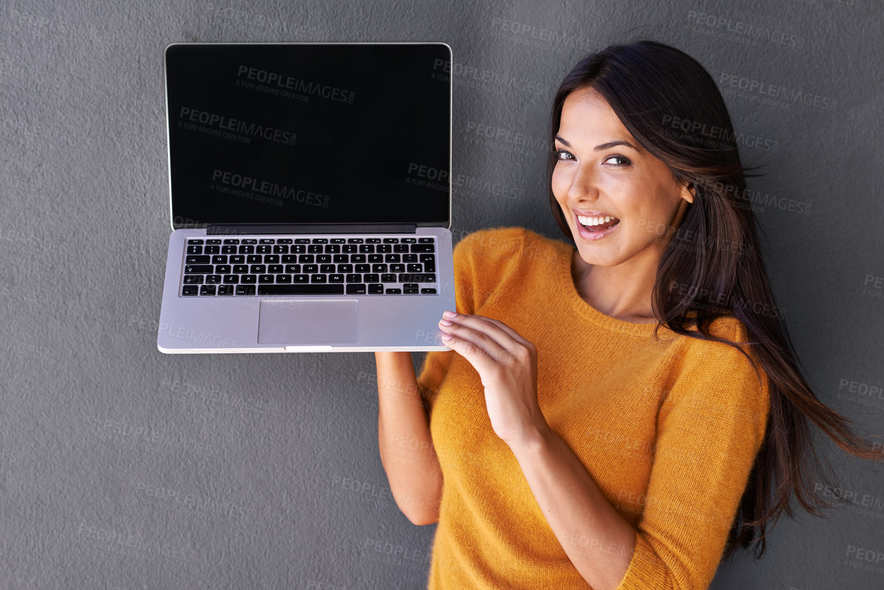 Buy stock photo Woman, portrait and laptop in studio, screen and mockup space for website or app. Happy female person, communication and blank display for marketing or advertising, social media and gray background