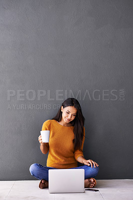 Buy stock photo Laptop, search and woman on floor with coffee while streaming, reading or watching movie on wall background. Computer, mockup or female person online for google it, menu or Netflix and chill sign up
