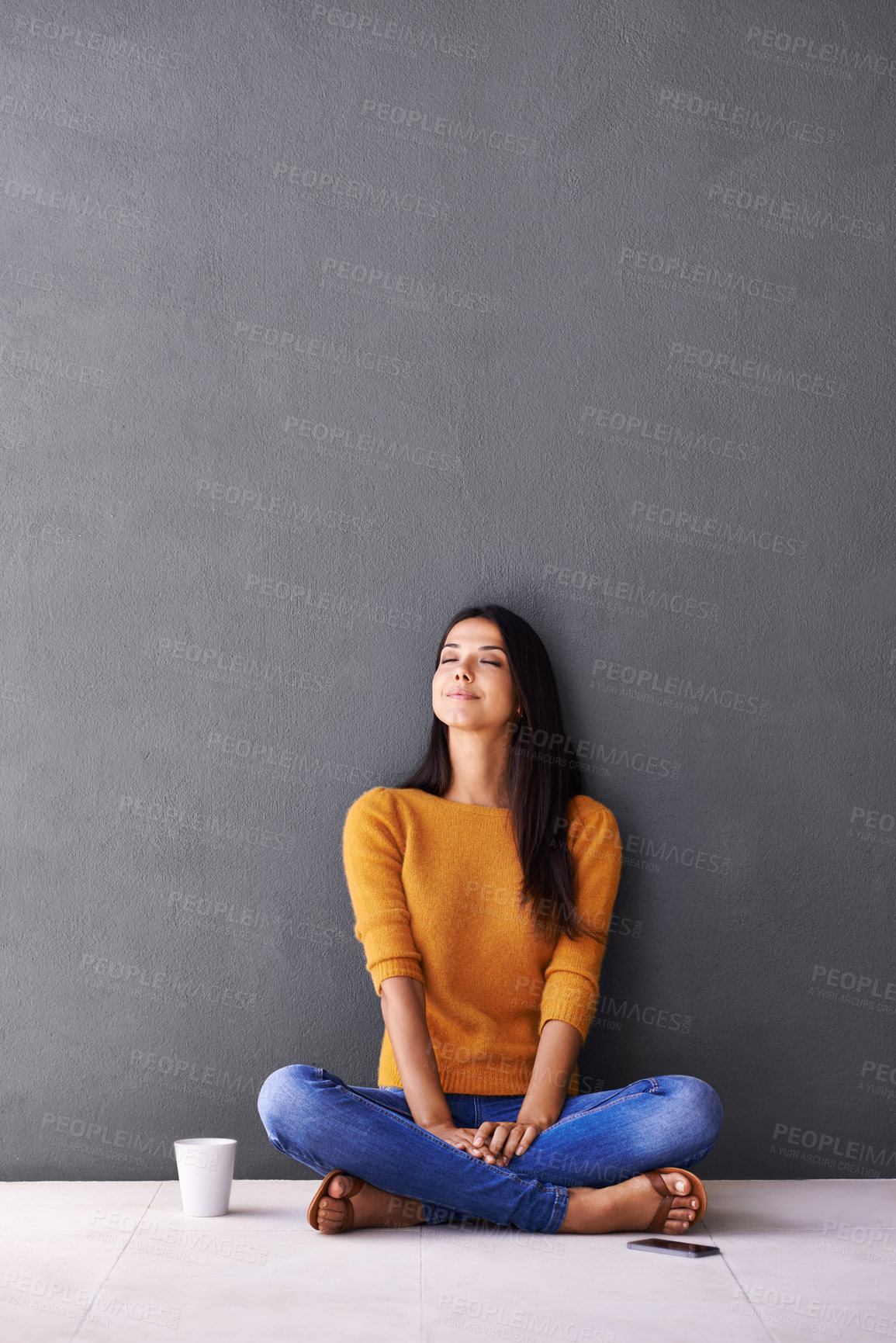 Buy stock photo Woman, peace and relax or breathe in home, calm and cup of coffee on floor of living room. Female person, mockup space and wall background for meditation, hot drink and daydreaming in apartment