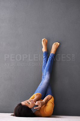 Buy stock photo Feet up, phone call or woman relax on a floor with mockup for chat, speaking or web communication on wall background. Smartphone, voice and female person with app, conversation and networking space