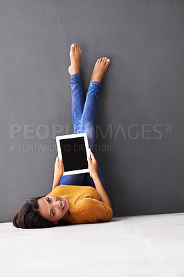 Buy stock photo Portrait, feet up or woman with tablet screen on floor for social media, scroll or search on wall background. Digital, space or person face on ground with google it, sign up or Netflix and chill app