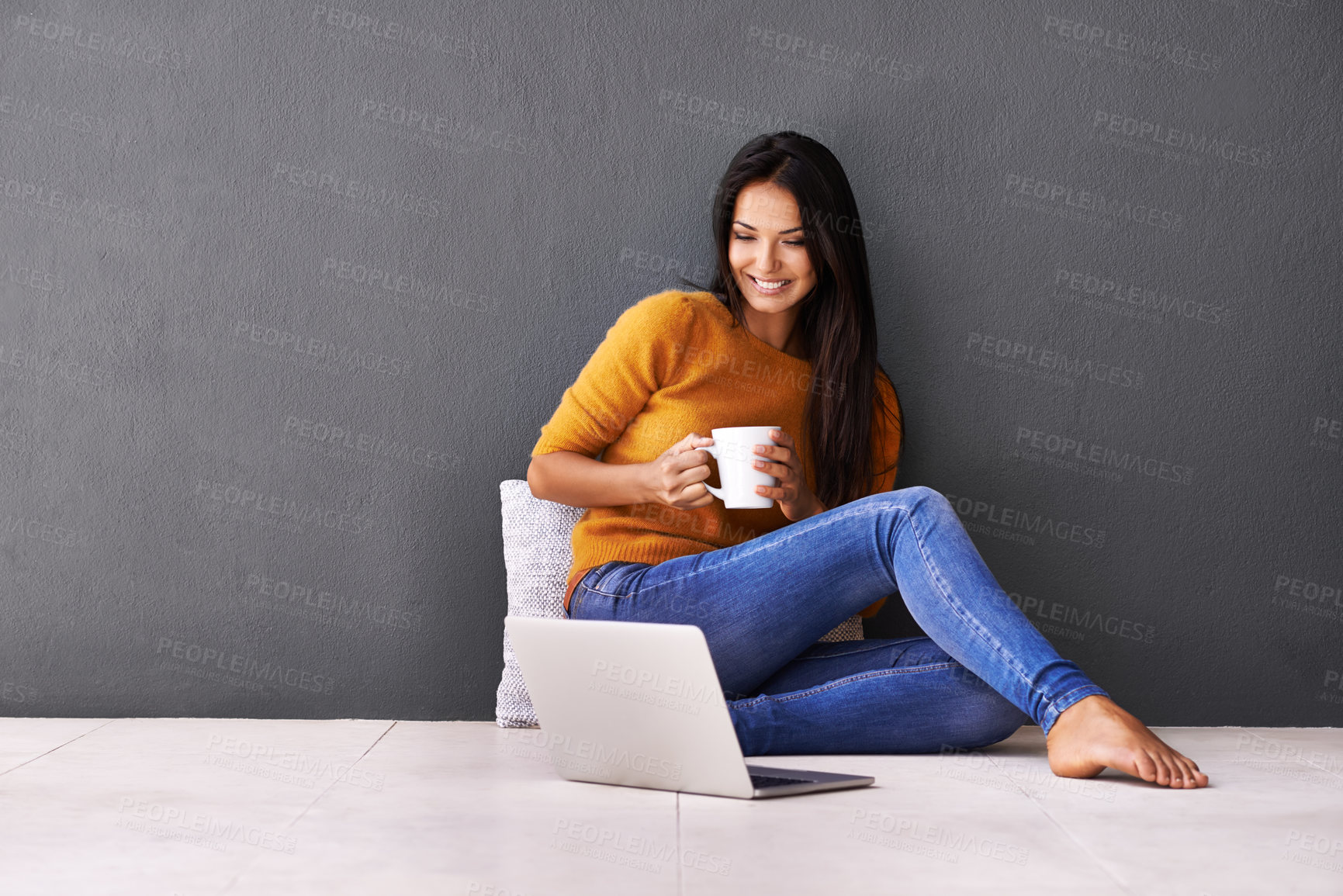 Buy stock photo Laptop, search and happy woman on a floor with coffee for streaming, reading or movie on wall background. Computer, mockup or female person online for google it, menu or Netflix and chill sign up