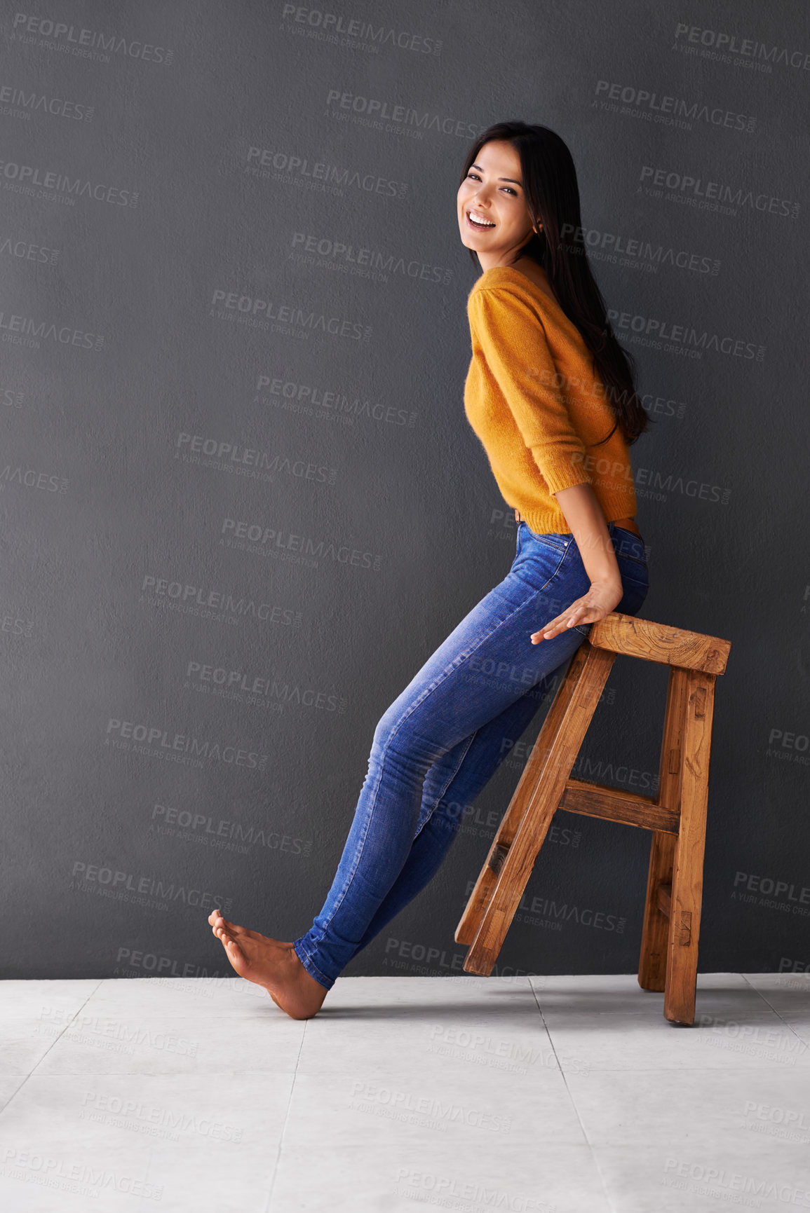 Buy stock photo Woman, smile and portrait on stool for clothes, trend and style for fashion and bold color for weekend. Female person, model and happy with jersey for casual outfit, stylish and fun on mockup