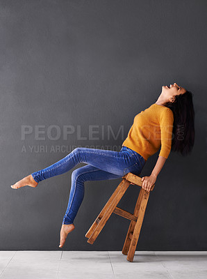 Buy stock photo Woman, chair and fashion for style, trendy and laugh for smile and apparel in clothes and excited. Female person, excited and lean on stool for wardrobe, confident and elegant beauty and mockup