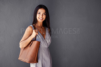 Buy stock photo Studio, portrait and handbag with woman, smile and accessories with dress and joy. Fashion, face and model with confidence, beauty and happiness with purse and style isolated on gray wall background