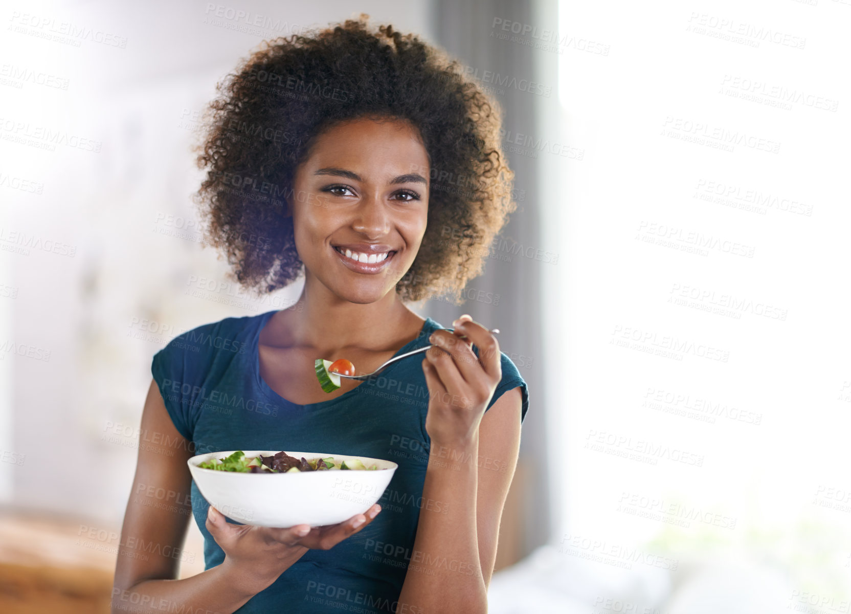 Buy stock photo Portrait of an attractive young woman eating a bowl of salad