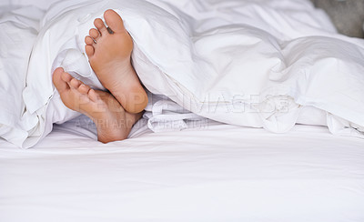 Buy stock photo Morning, relax and feet in duvet in hotel, hospitality and holiday or vacation for person in bed. Tired, calm and sleepy in bedroom, barefoot and dreaming, comfortable and peaceful on mattress