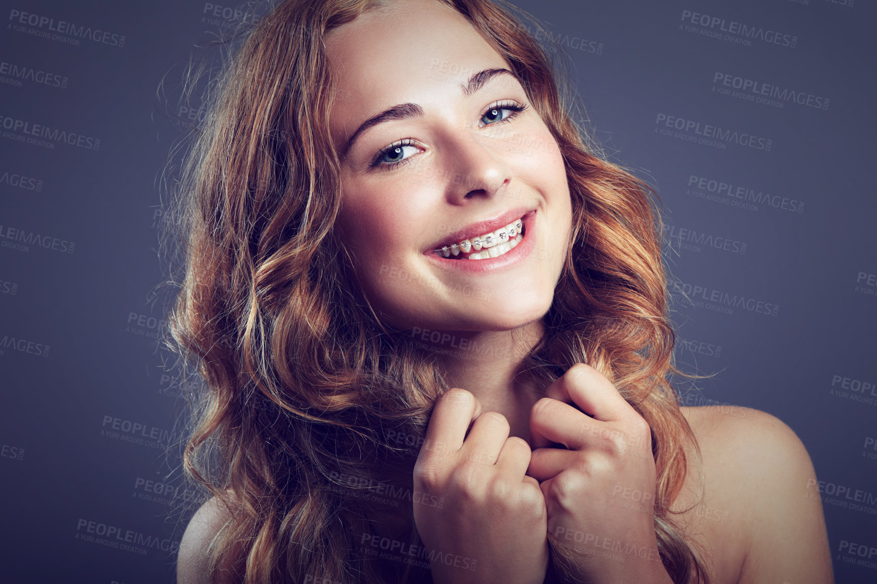 Buy stock photo Portrait, beauty and braces with smile of woman in studio on dark background for natural wellness. Face, hair and dental care with happy young person looking satisfied with cosmetics or oral hygiene