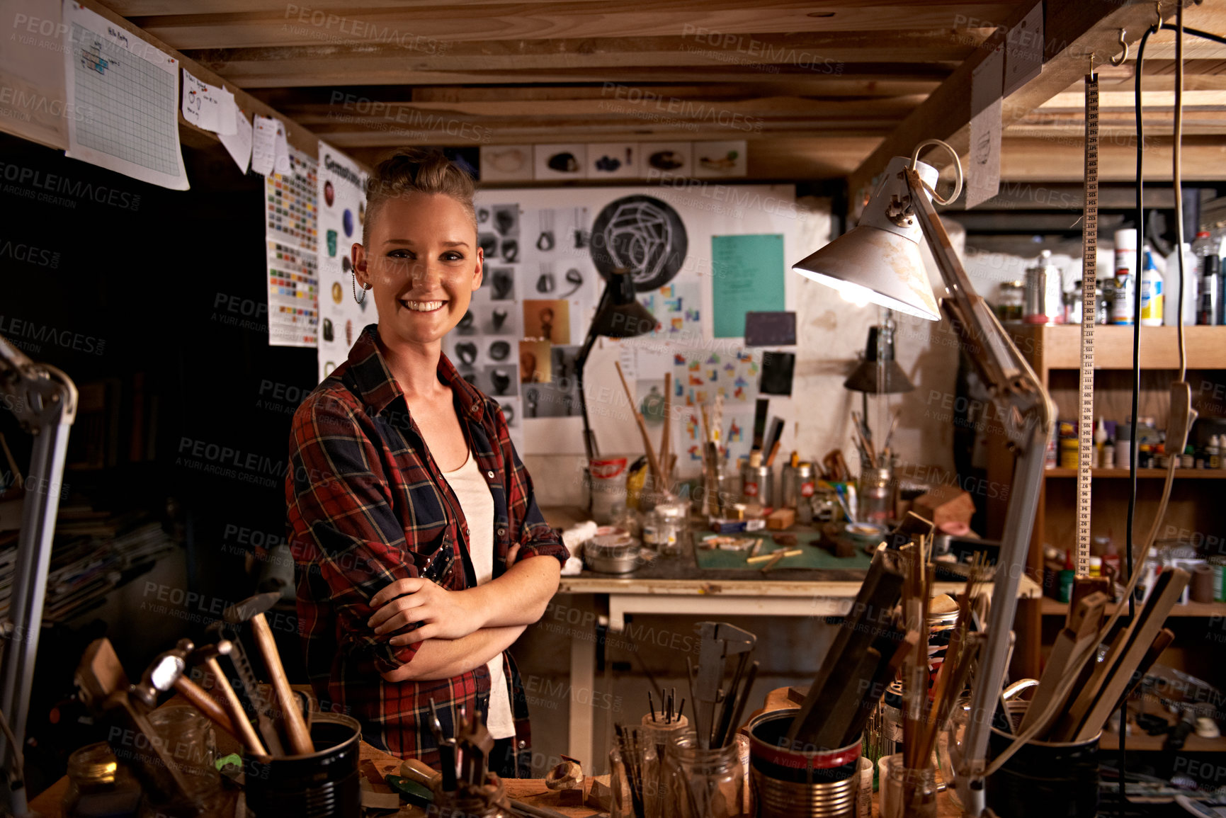 Buy stock photo Artist, studio and portrait of happy woman in workshop to work on creative sculpture or project at night. Artisan, workplace or arms crossed for pride or confidence as carpenter with talent and tools