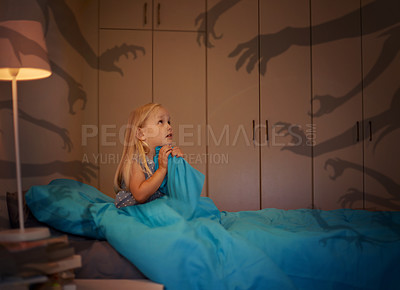 Buy stock photo Fear, shadow and monster with a girl in bed at night feeling afraid or scared of the dark. Kids, horror or nightmare with a young female child sitting alone in a dark, spooky and creepy bedroom