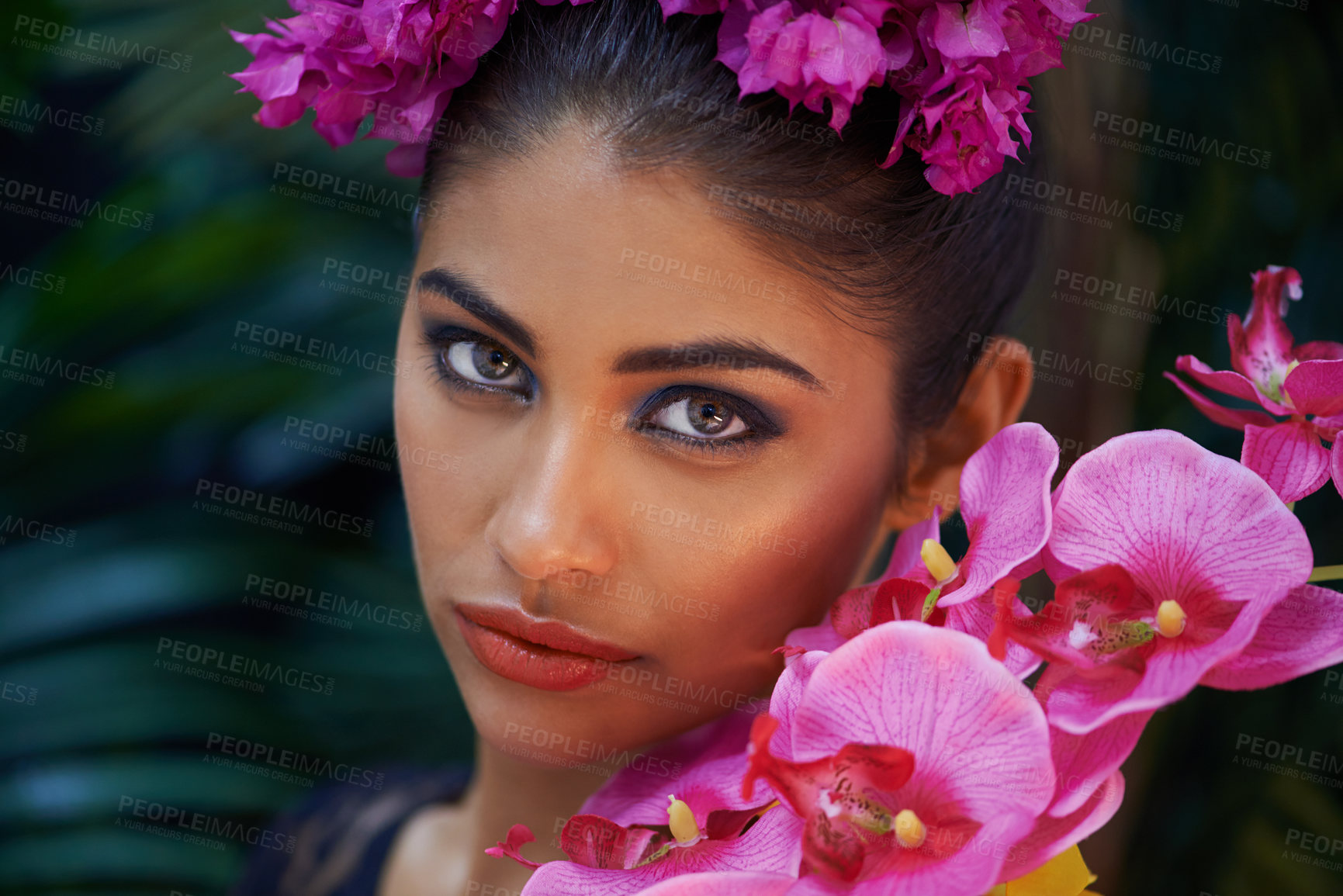 Buy stock photo Jungle, portrait or woman with flowers for skincare, natural beauty or wellness in nature aesthetic. Color, Indian person or face of model with at eco friendly cosmetics, plants or spring floral art 