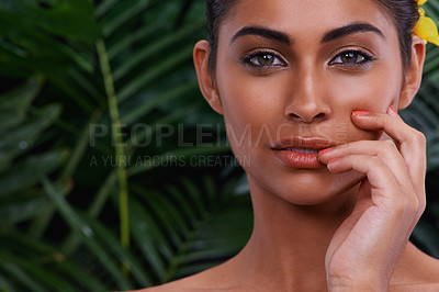 Buy stock photo A portrait of a beautiful woman wearing flowers in her hair in the jungle