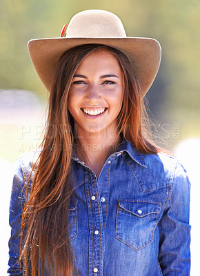 Buy stock photo Cowgirl, portrait and hat at farm, smile and western fashion for agriculture, work and outdoor in summer. Woman, person and farmer at ranch for sustainability, countryside and environment in Texas