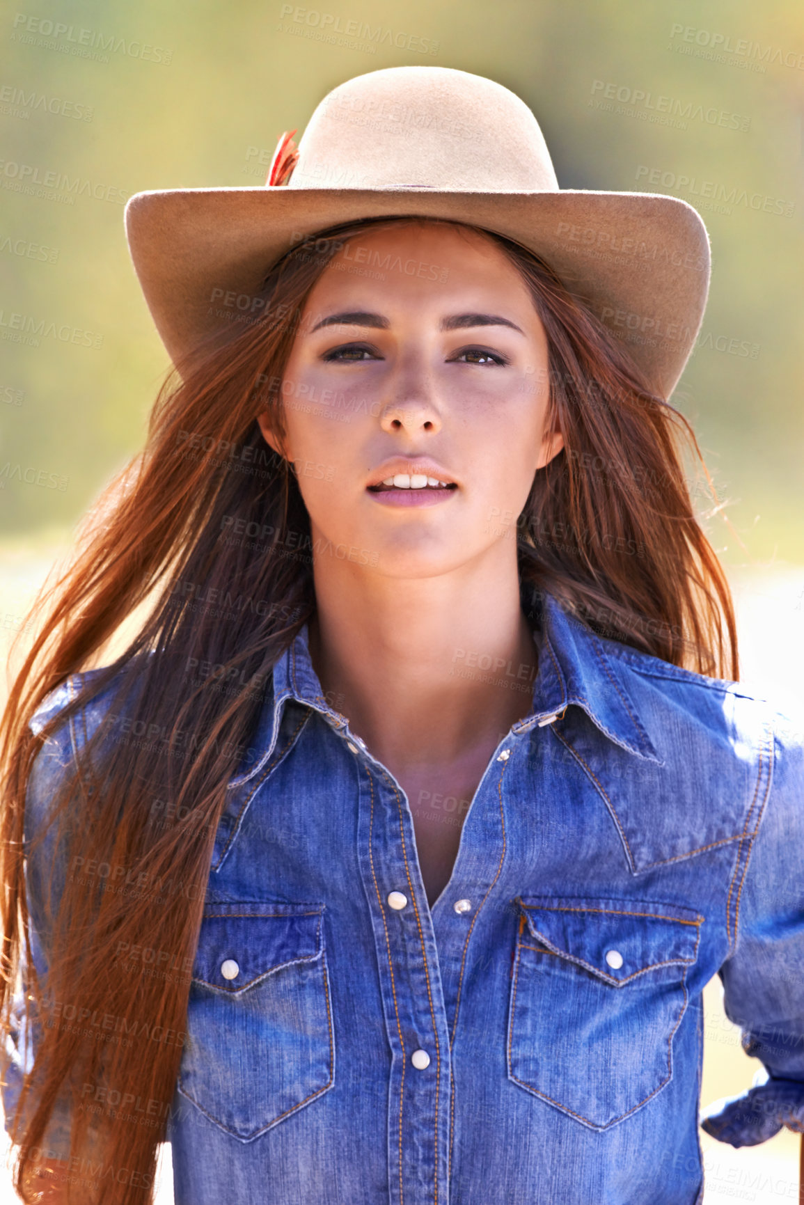 Buy stock photo Cowgirl, portrait and hat at farm, field and western fashion for agriculture, work and outdoor in summer. Woman, person and farmer at ranch for sustainability, countryside and environment in Texas
