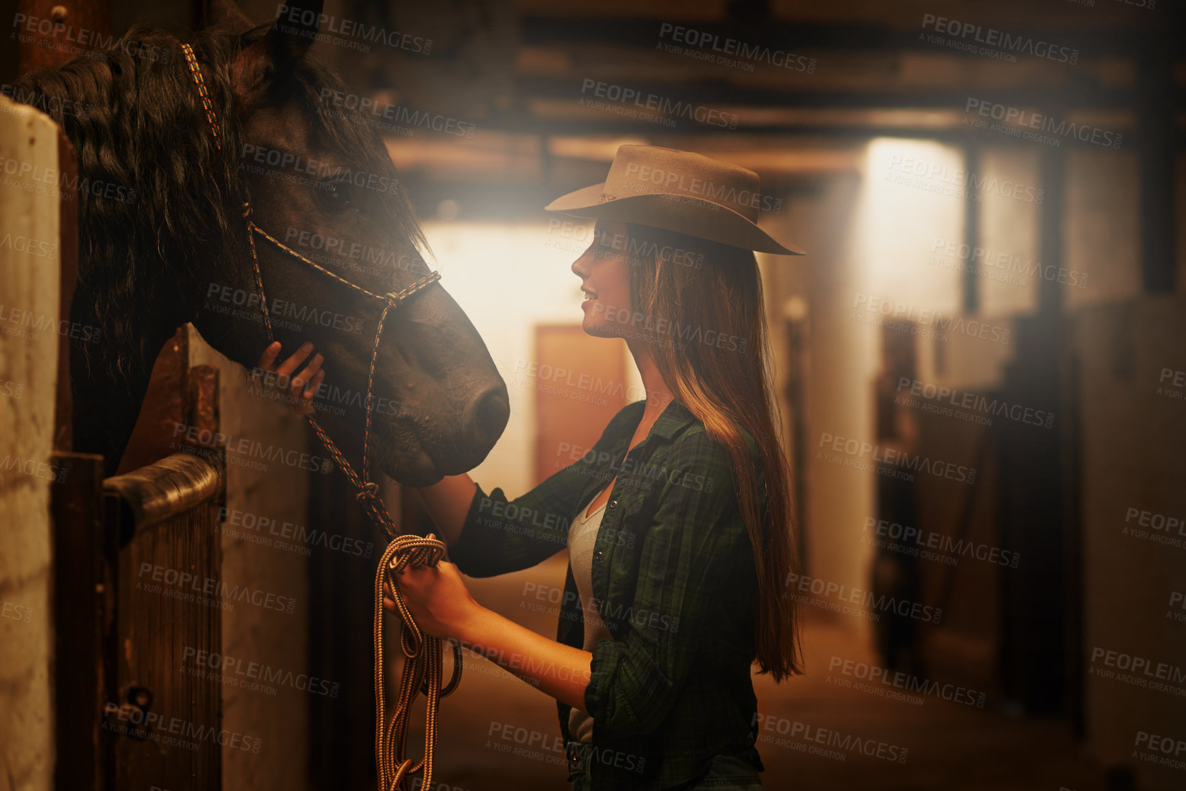 Buy stock photo Cowgirl, happy and woman with horse at barn or stable in Texas for recreation. Western, animal and smile of person at ranch with pet or stallion for hobby with care for livestock at equestrian farm