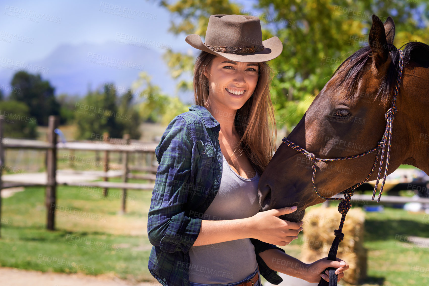 Buy stock photo Cowgirl, portrait and happy woman with horse at farm outdoor in summer or nature in Texas for recreation. Western hat, face or person with animal at ranch, pet or stallion in the rural countryside