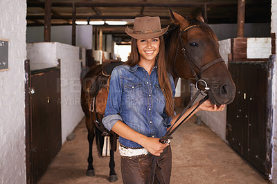 Buy stock photo Cowgirl, portrait and happy woman with horse at barn or stable in Texas for recreation. Western hat, person and animal at ranch with pet, livestock or stallion for hobby with care at equestrian farm