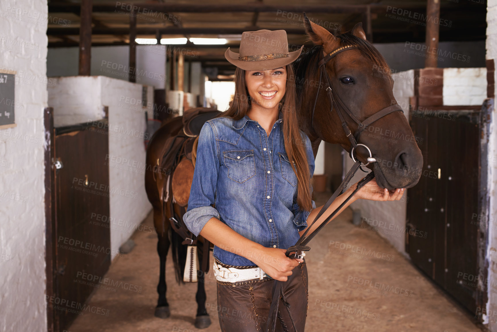 Buy stock photo Cowgirl, portrait and happy woman with horse at barn or stable in Texas for recreation. Western hat, person and animal at ranch with pet, livestock or stallion for hobby with care at equestrian farm