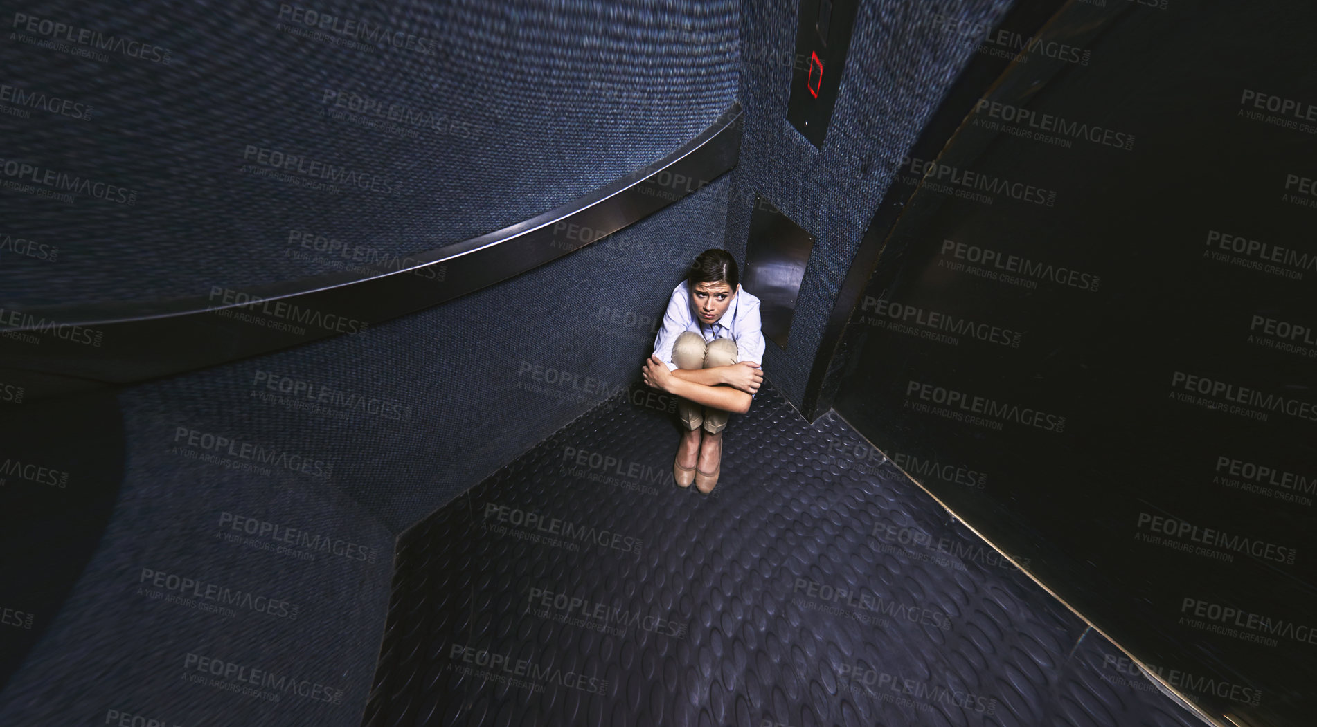 Buy stock photo Distorted shot of a young woman trapped in an elevator