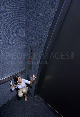 Buy stock photo Business, person and fear of elevator with worry for trapped, claustrophobia or anxiety in emergency. Office, lift and woman scared for safety in space or nightmare panic attack from stress in crisis