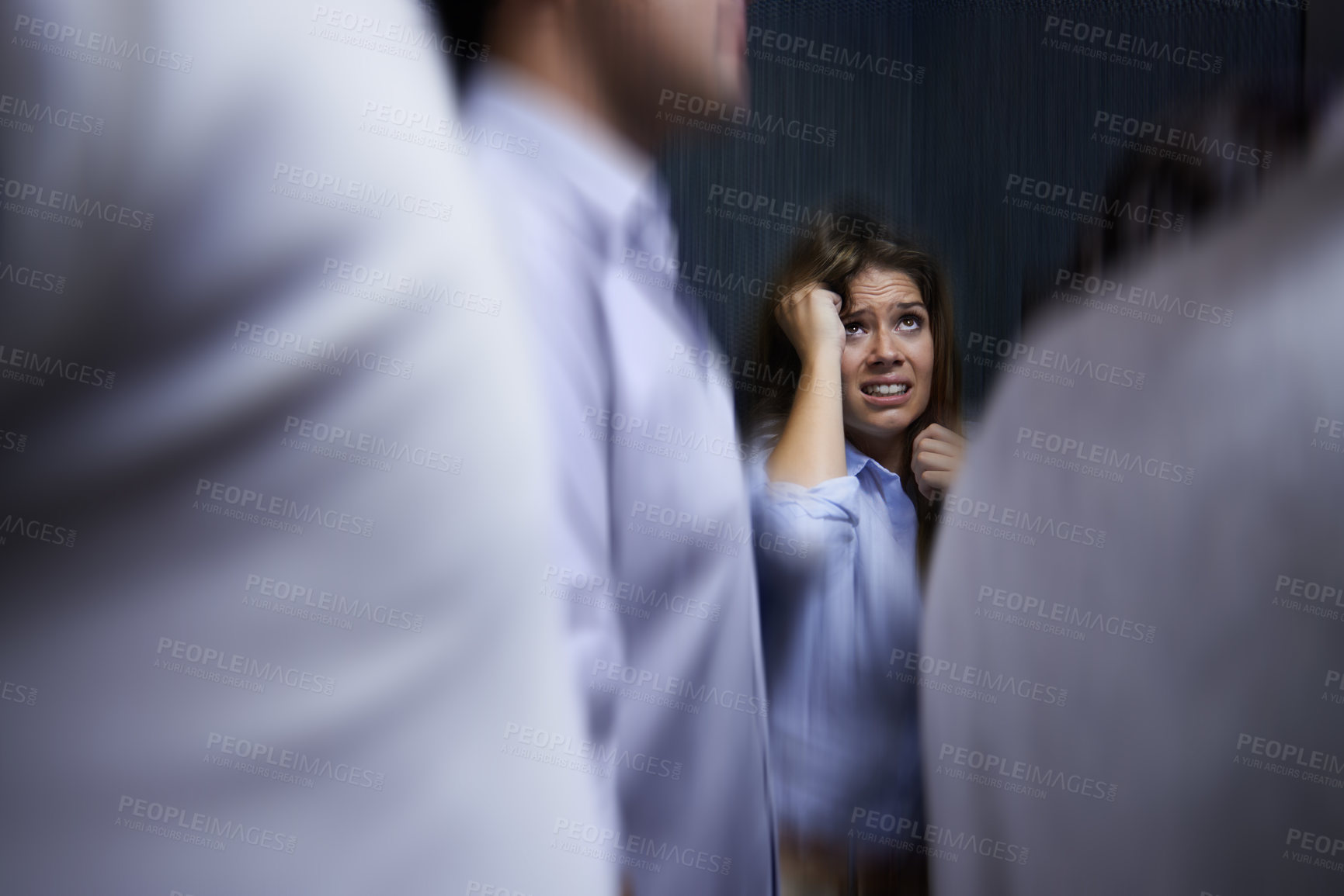 Buy stock photo Woman, people and trapped with social anxiety at work with stress, scared and overthinking with concern. Female person, coworkers and crowd with worry for deadline at office and stuck at office
