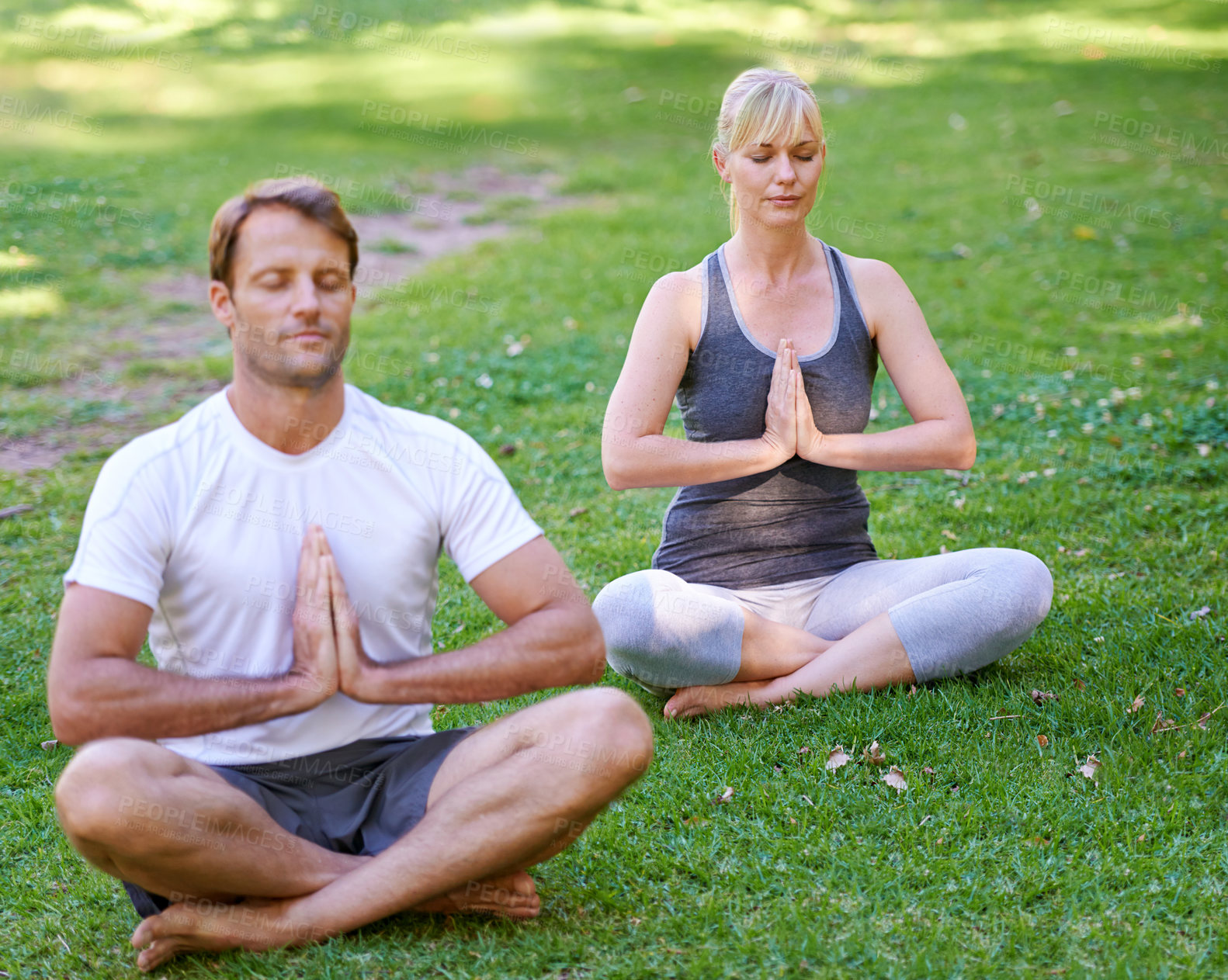 Buy stock photo Praying, hands and couple with park meditation, peace or mental health wellness in nature. Balance, spirituality or people in a garden with prayer pose for breathing exercise, zen or holistic healing