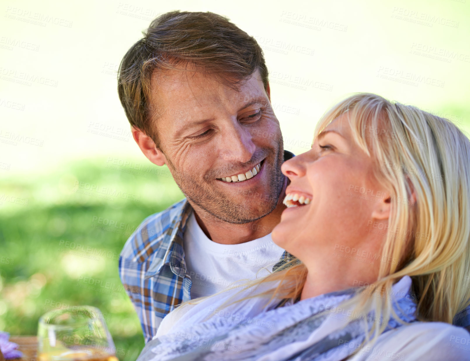 Buy stock photo Couple, embrace and relax in park with wine glass for bonding connection on holiday, celebration or summer. Man, woman and drinking in nature with or happiness date as marriage, honeymoon or love